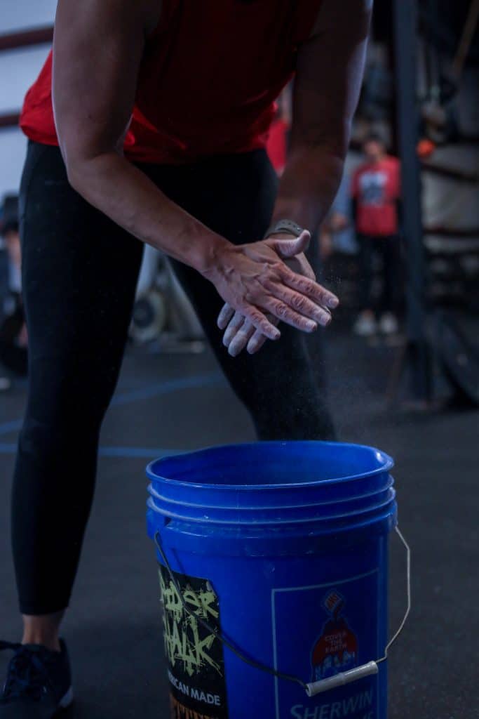 Hands in chalk bucket